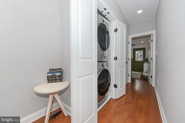 a view of a hallway with washer and dryer