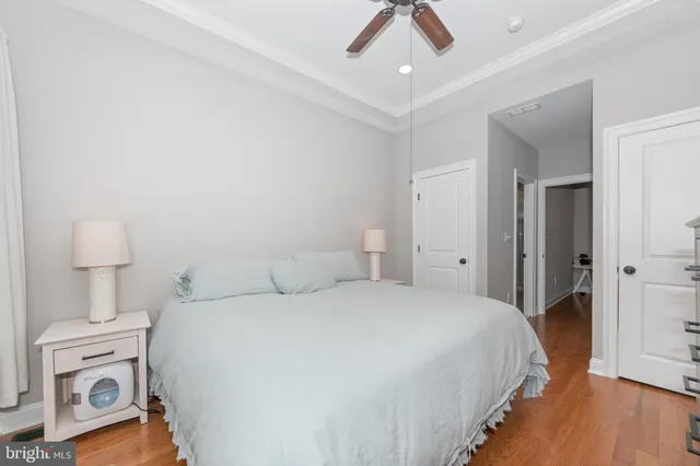 a bedroom with a bed and a lamp on table