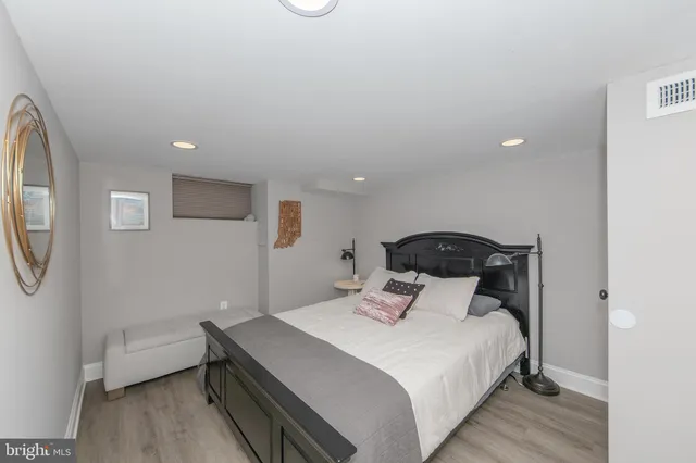 a bedroom with a bed and a table