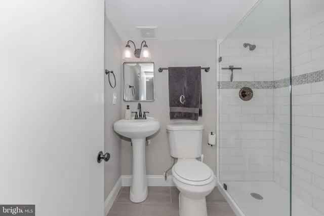 a bathroom with a shower and a toilet