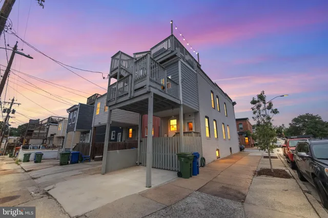 a view of a swimming pool with a table and chairs