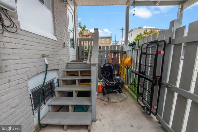 a view of a car park in front of a house