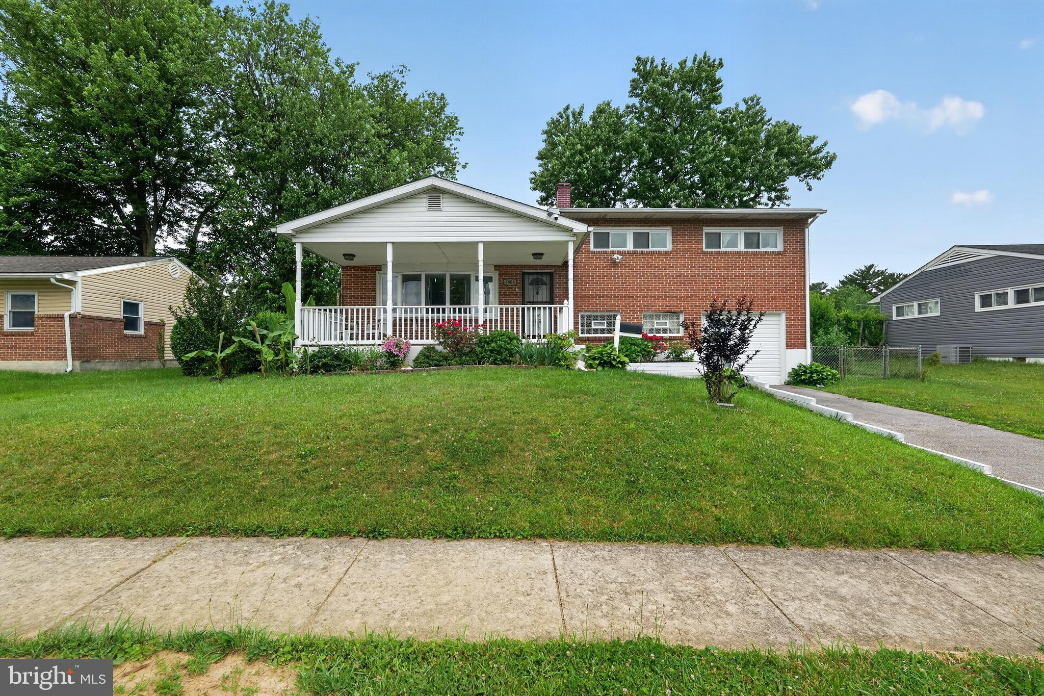 5909 Charnwood Road Catonsville, MD 21228 - Photo 1 of 31 Charming brick home with lush greenery.
