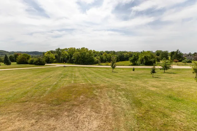 a view of a lake with a big yard