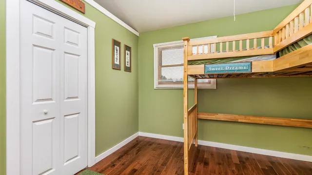 a bathroom with a granite countertop tub sink and mirror