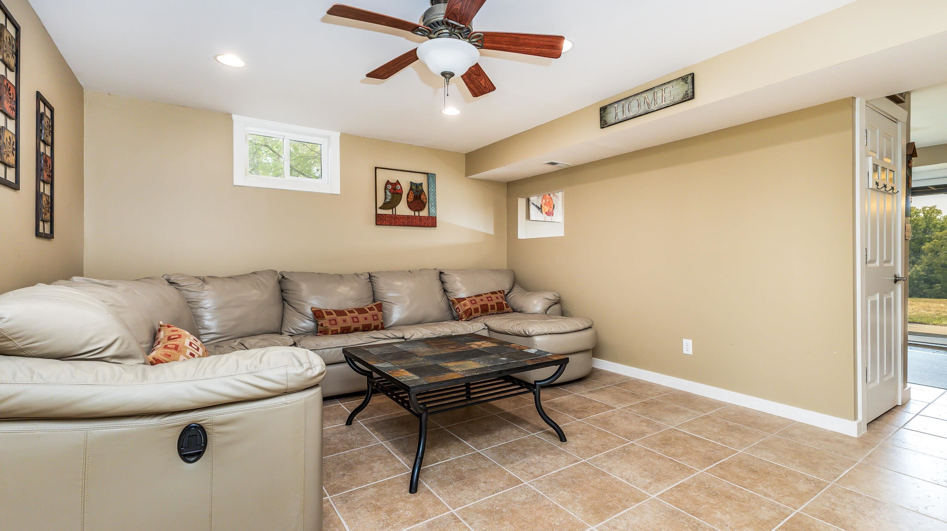 2 Sunbow Path Galena, IL 61036 - Photo 30 of 37 a living room with furniture and a potted plant