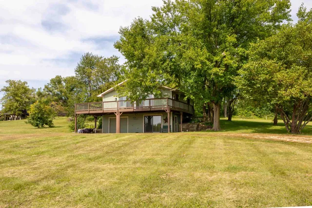 a house with trees in the background