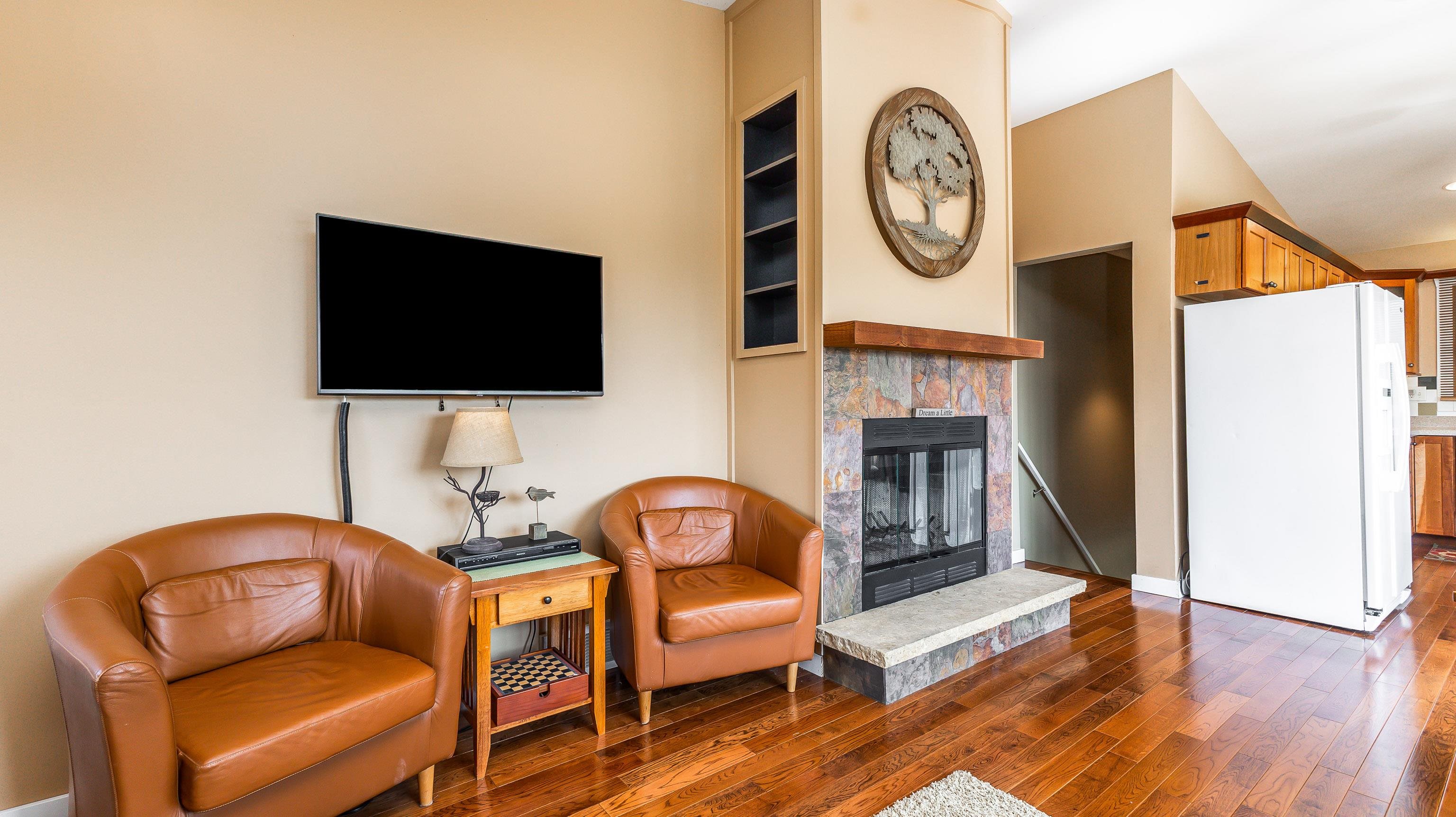 2 Sunbow Path Galena, IL 61036 - Photo 9 of 37 a living room with furniture a flat screen tv and a fireplace