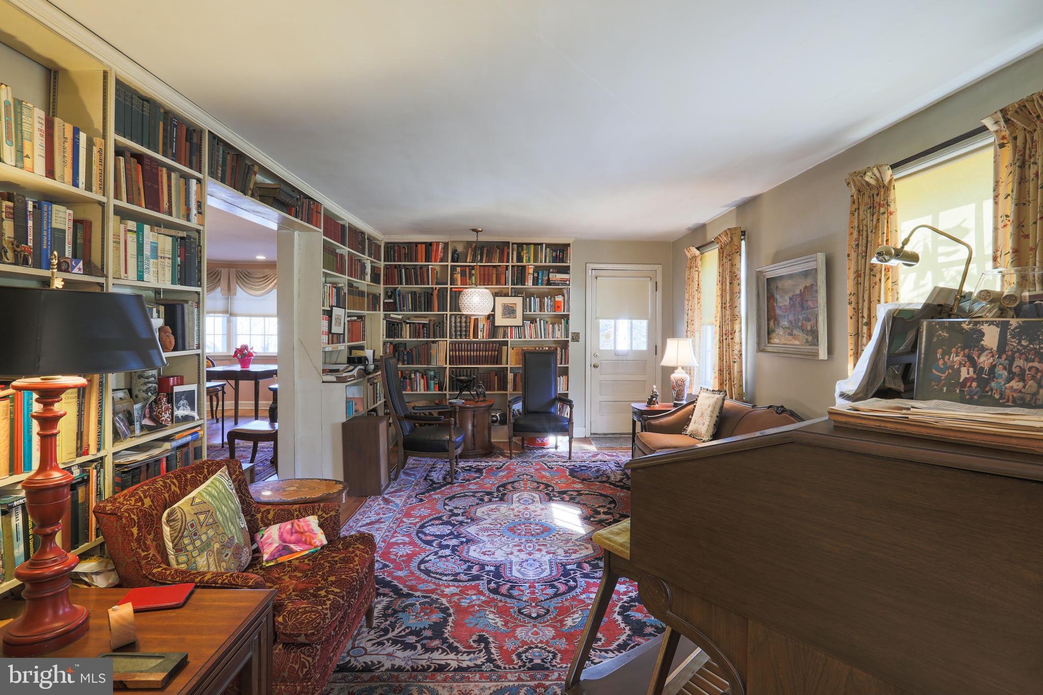 A living room lined with bookshelves