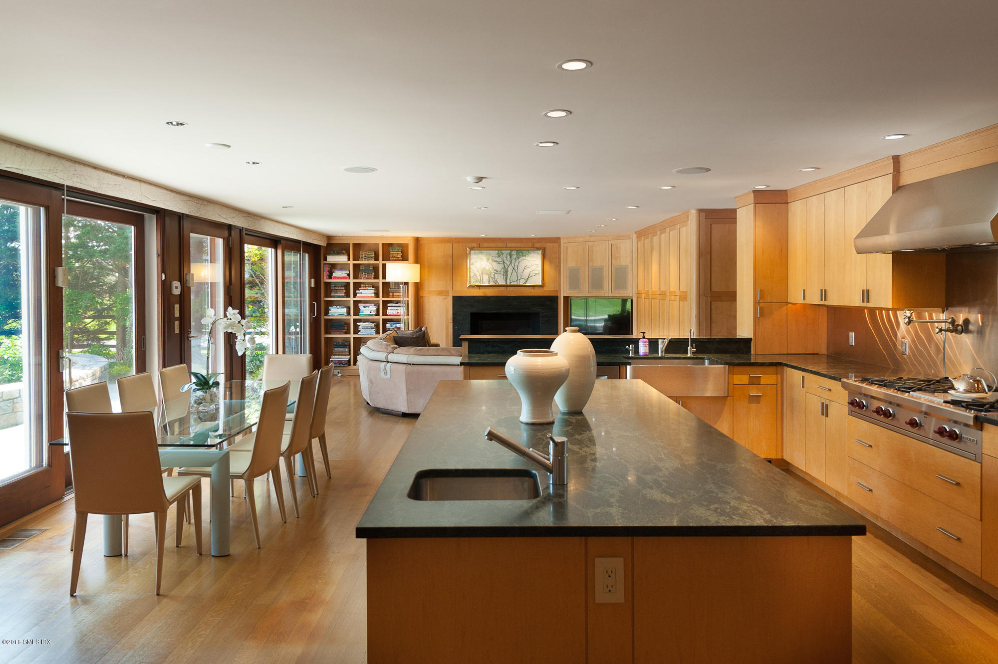2 Seagate Road Riverside, CT 06878 - Photo 11 of 38 a view of a dining room with furniture a chandelier and wooden floor