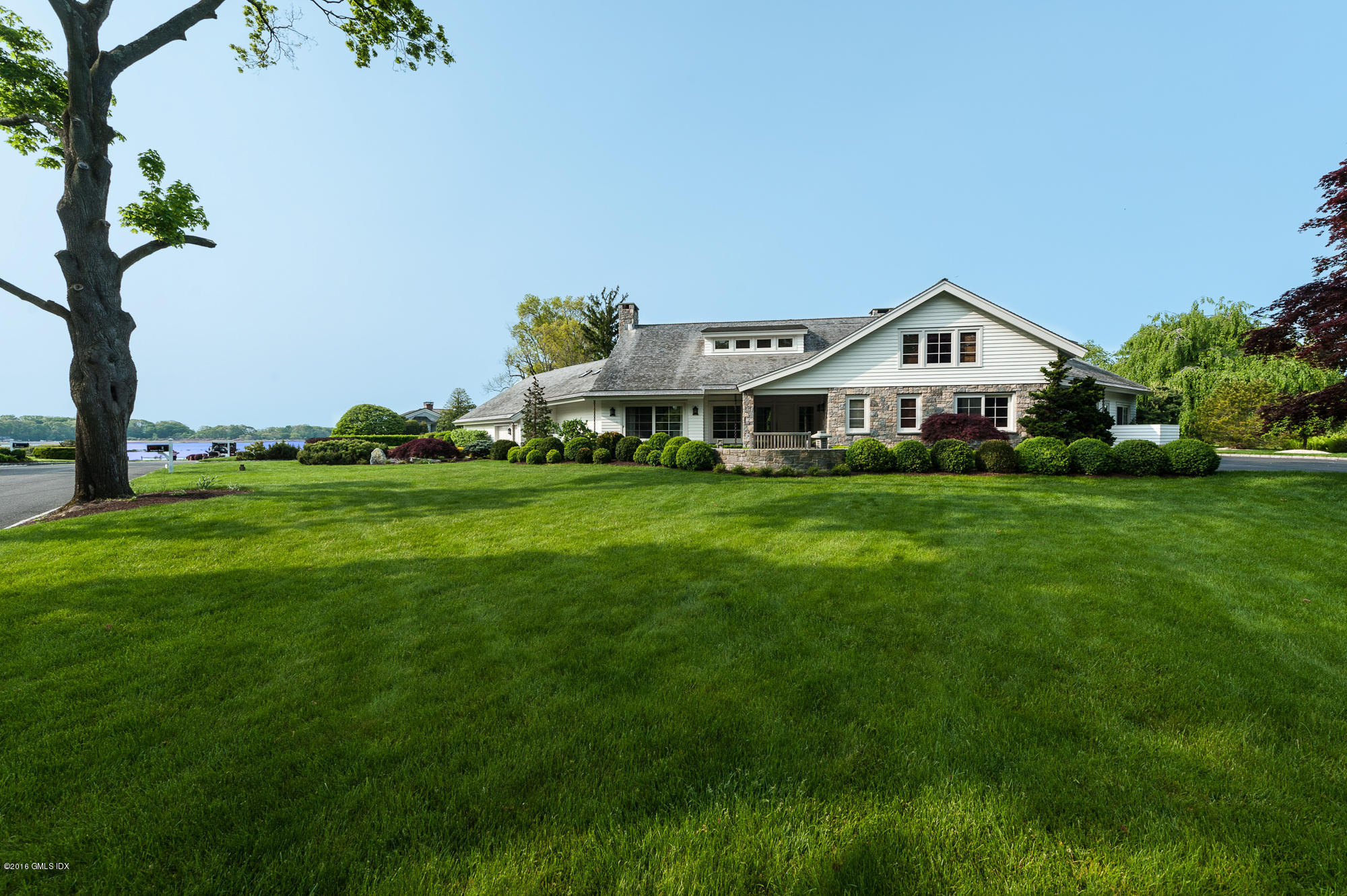 2 Seagate Road Riverside, CT 06878 - Photo 2 of 38 a front view of a house with a yard