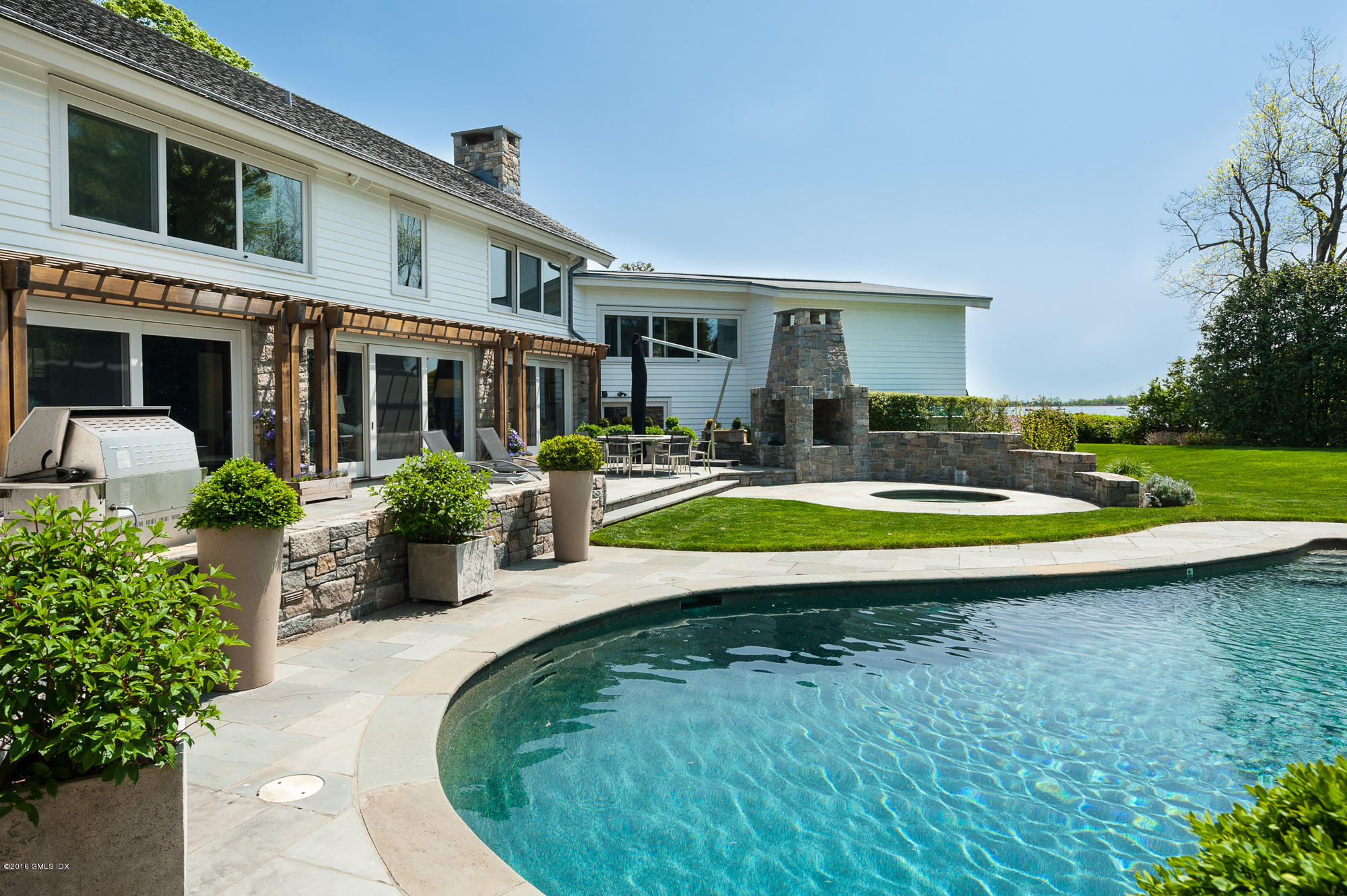2 Seagate Road Riverside, CT 06878 - Photo 25 of 38 a view of swimming pool with outdoor seating and yard