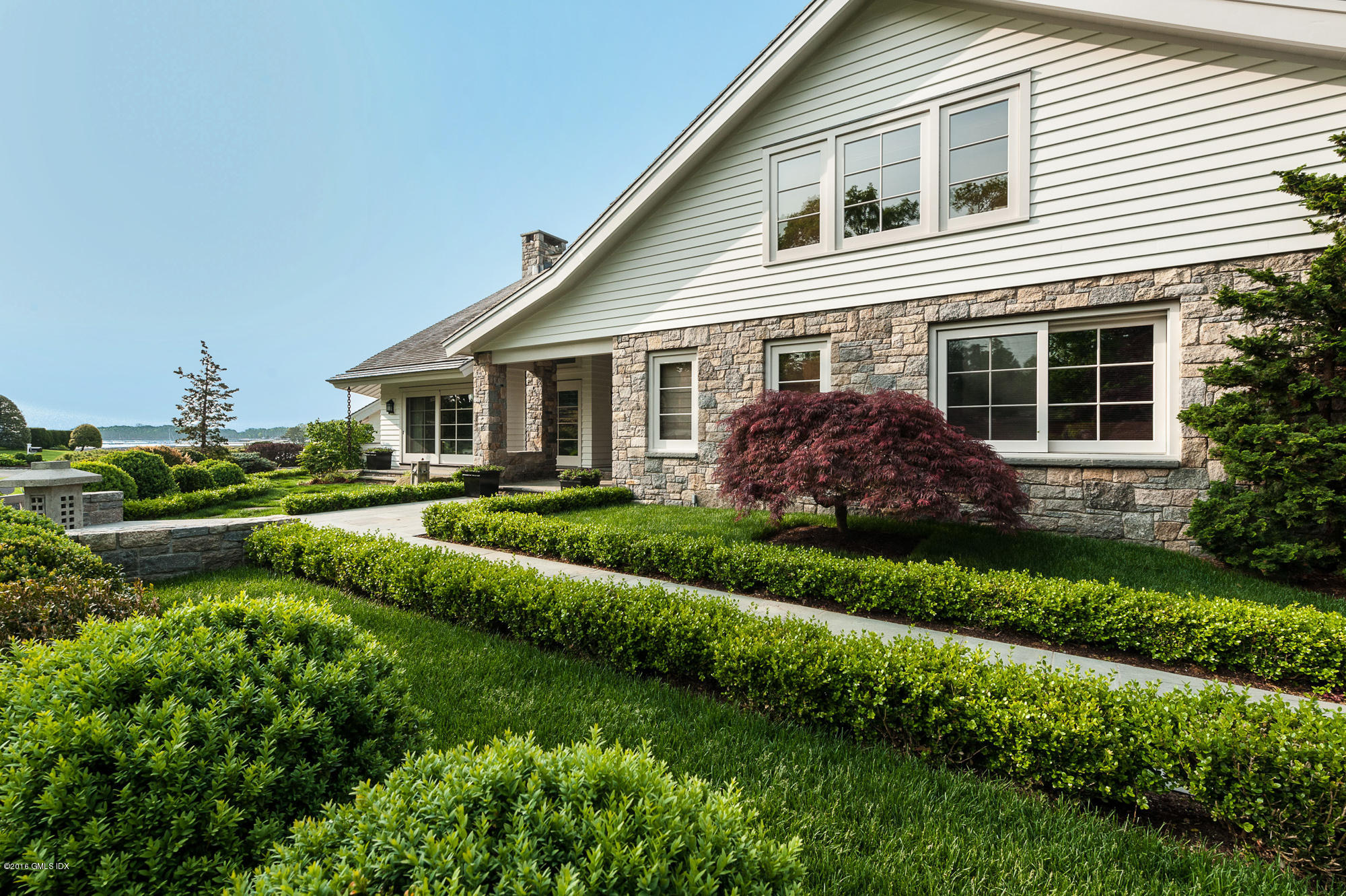 2 Seagate Road Riverside, CT 06878 - Photo 30 of 38 a view of house with a yard and plants