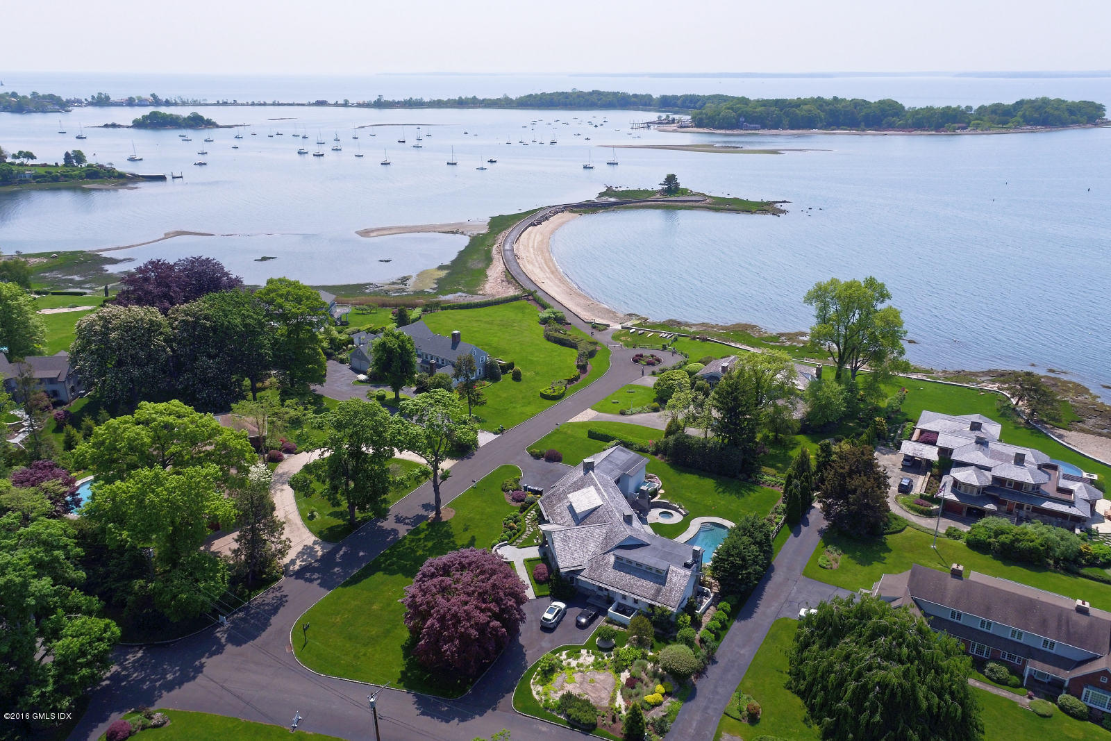 2 Seagate Road Riverside, CT 06878 - Photo 3 of 38 an aerial view of a house with a garden and lake view
