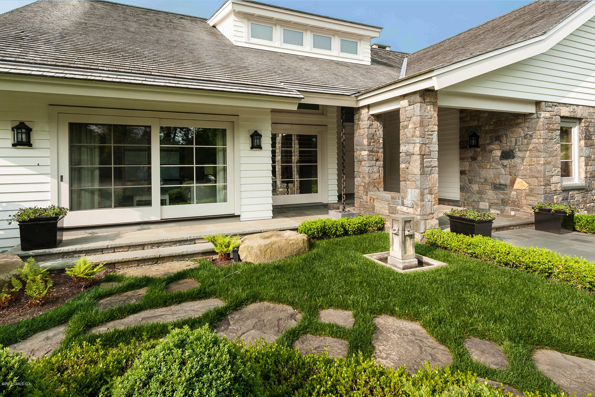 2 Seagate Road Riverside, CT 06878 - Photo 31 of 38 a front view of a house with garden