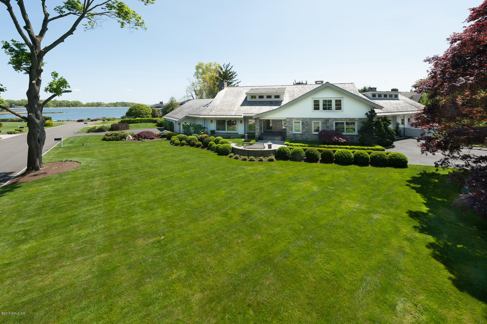 2 Seagate Road Riverside, CT 06878 - Photo 33 of 38 a car parked in the grass near a building