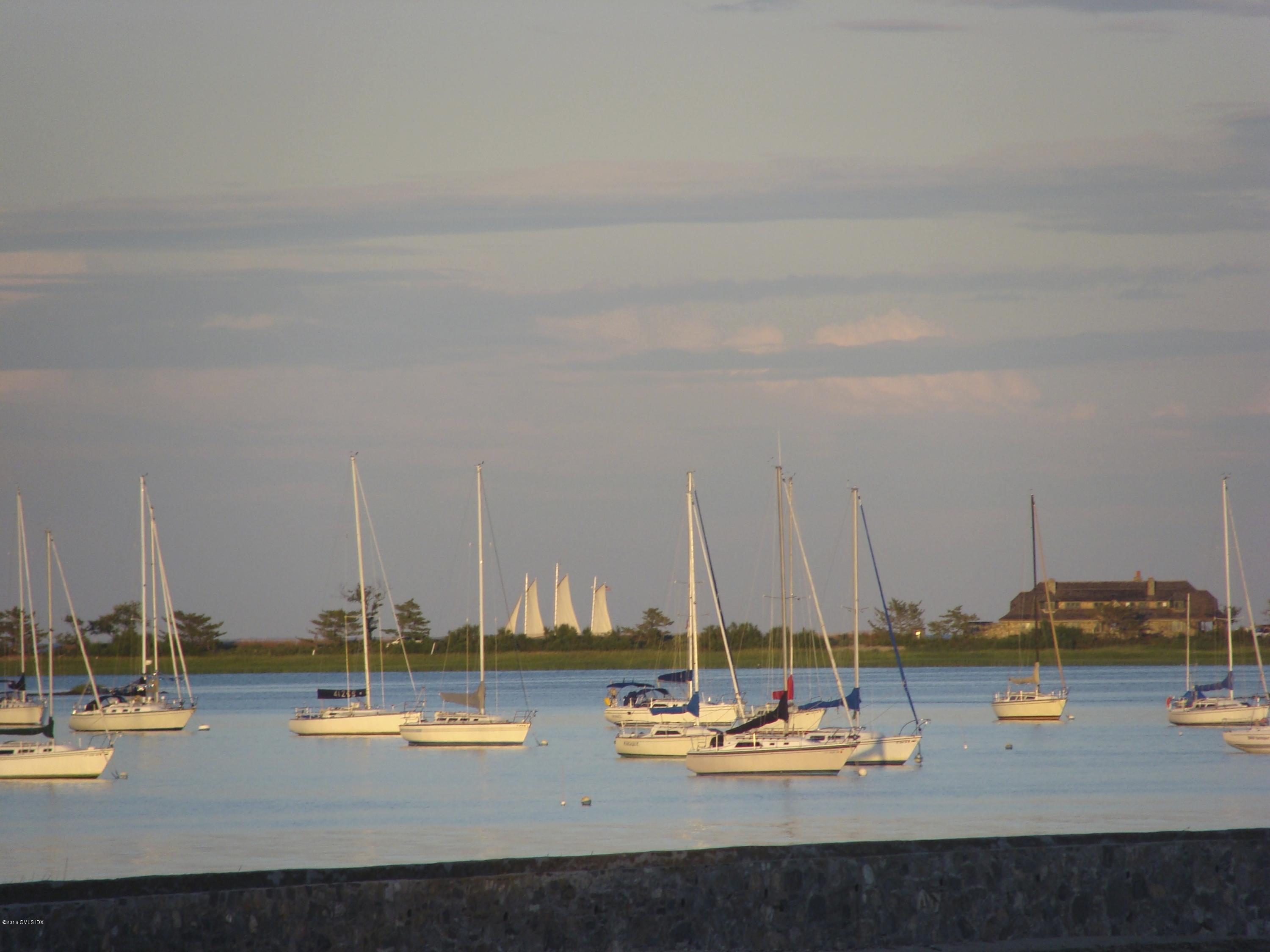 2 Seagate Road Riverside, CT 06878 - Photo 36 of 38 a view of a lake with boats next to a road