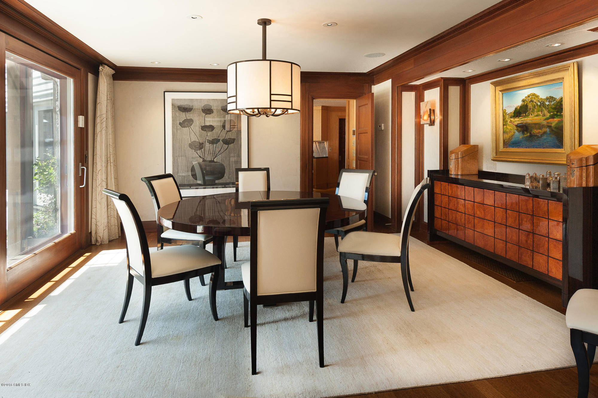 2 Seagate Road Riverside, CT 06878 - Photo 6 of 38 a dining room with furniture a chandelier and wooden floor