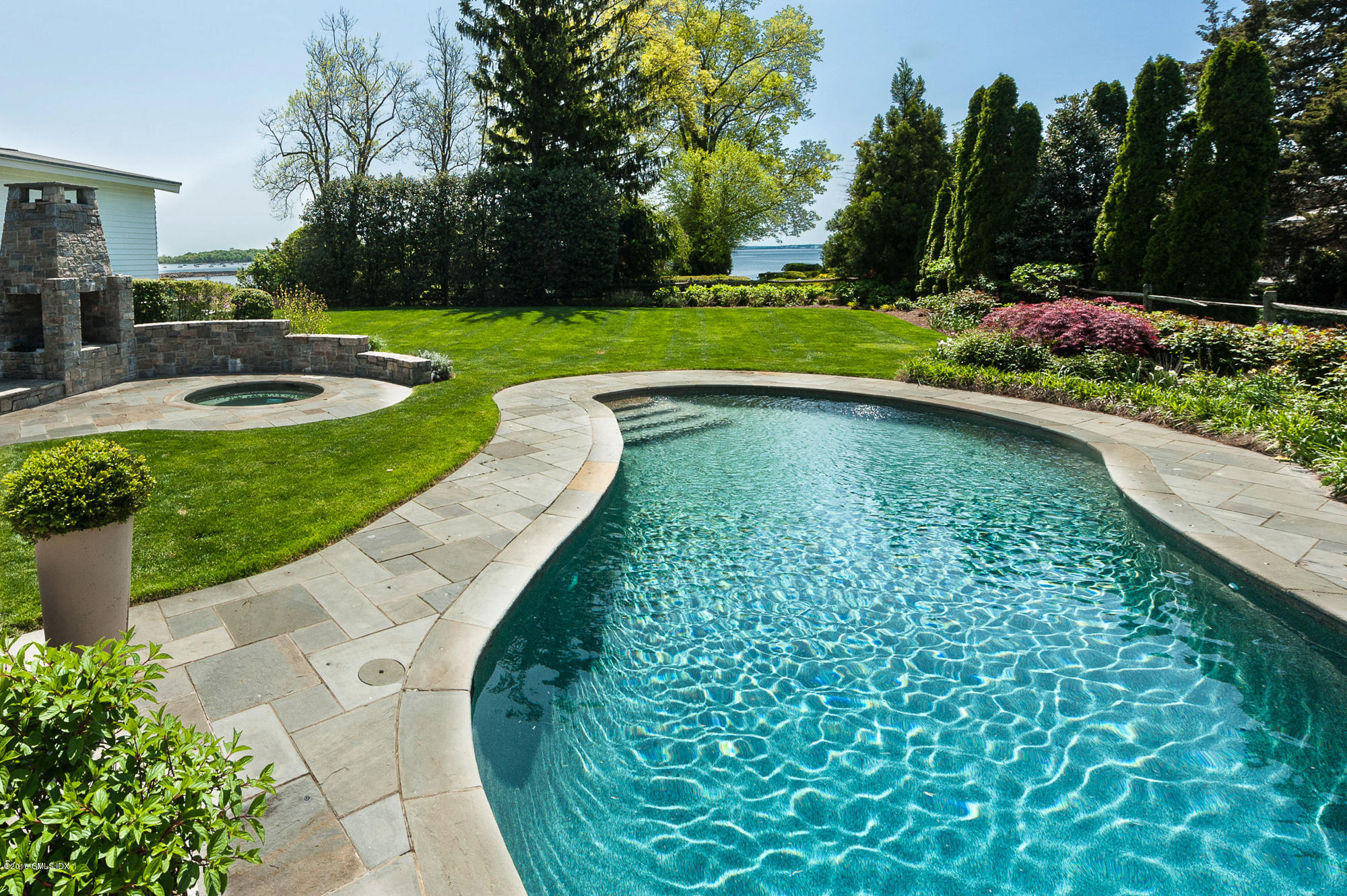 2 Seagate Road Riverside, CT 06878 - Photo 9 of 38 a view of a swimming pool with a patio