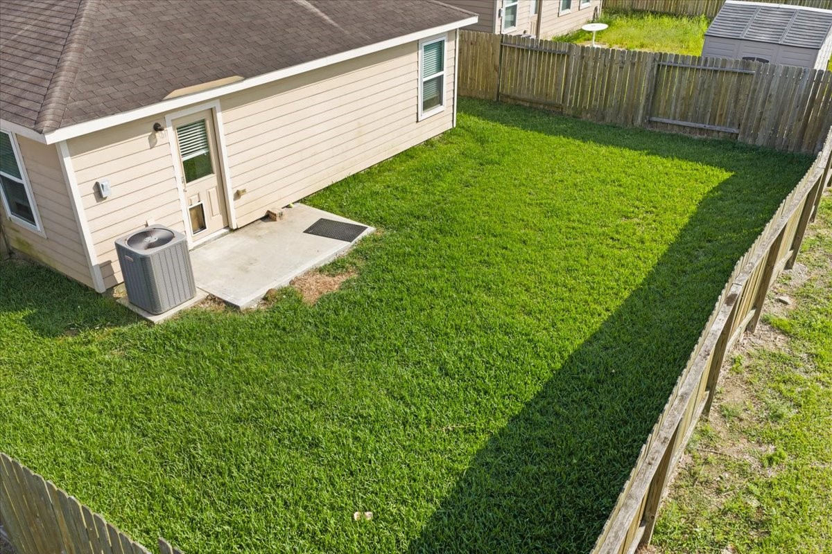 5727 Treasure Cove Road Cove, TX 77523 - Photo 18 of 20 a view of backyard with wooden fence