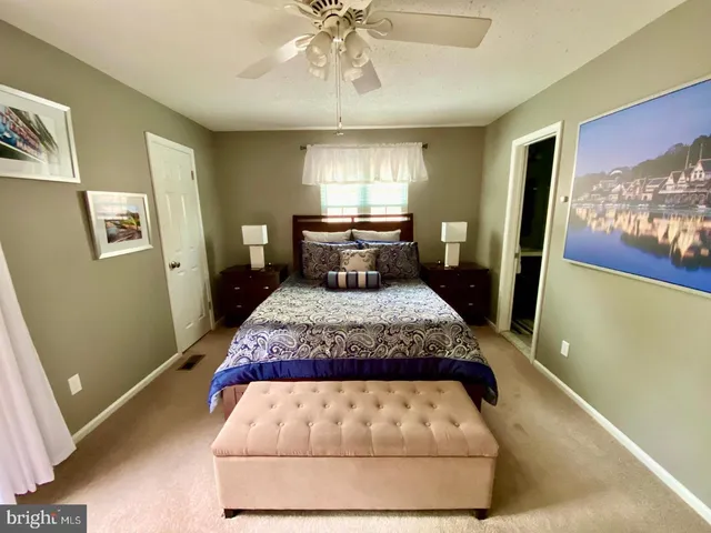 a room with a bed and window