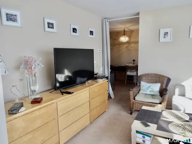 a room with furniture and a mirror