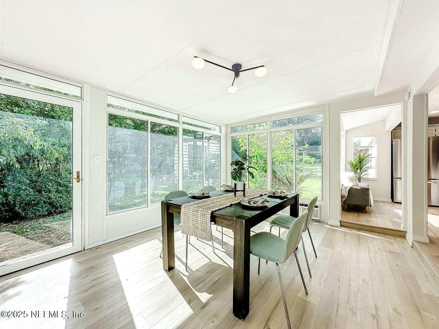 8735 Moss Haven Road Jacksonville, FL 32221 - Photo 15 of 29 a view of a livingroom with furniture and wooden floor