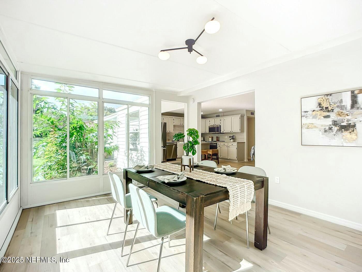 8735 Moss Haven Road Jacksonville, FL 32221 - Photo 7 of 29 a view of a workspace with furniture and a window