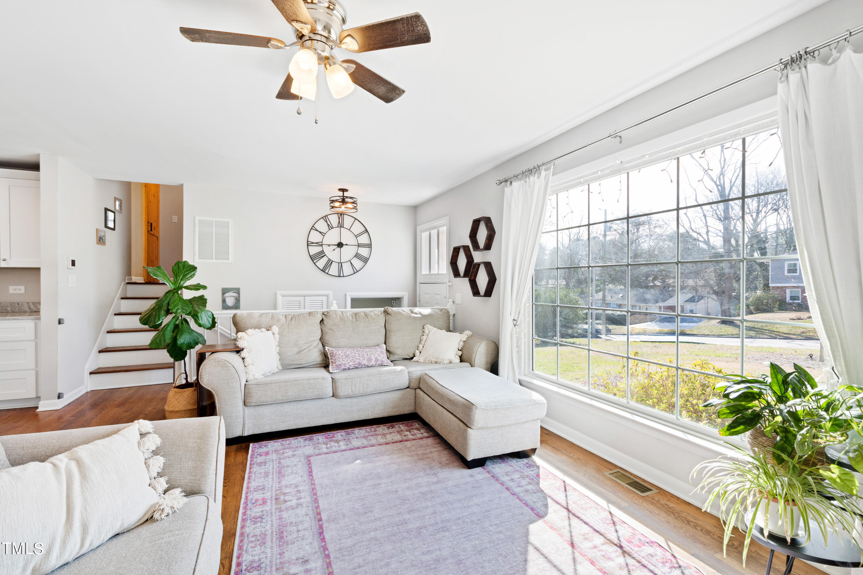 2413 Kennington Road Raleigh, NC 27610 - Photo 11 of 33 a living room with furniture and a large window