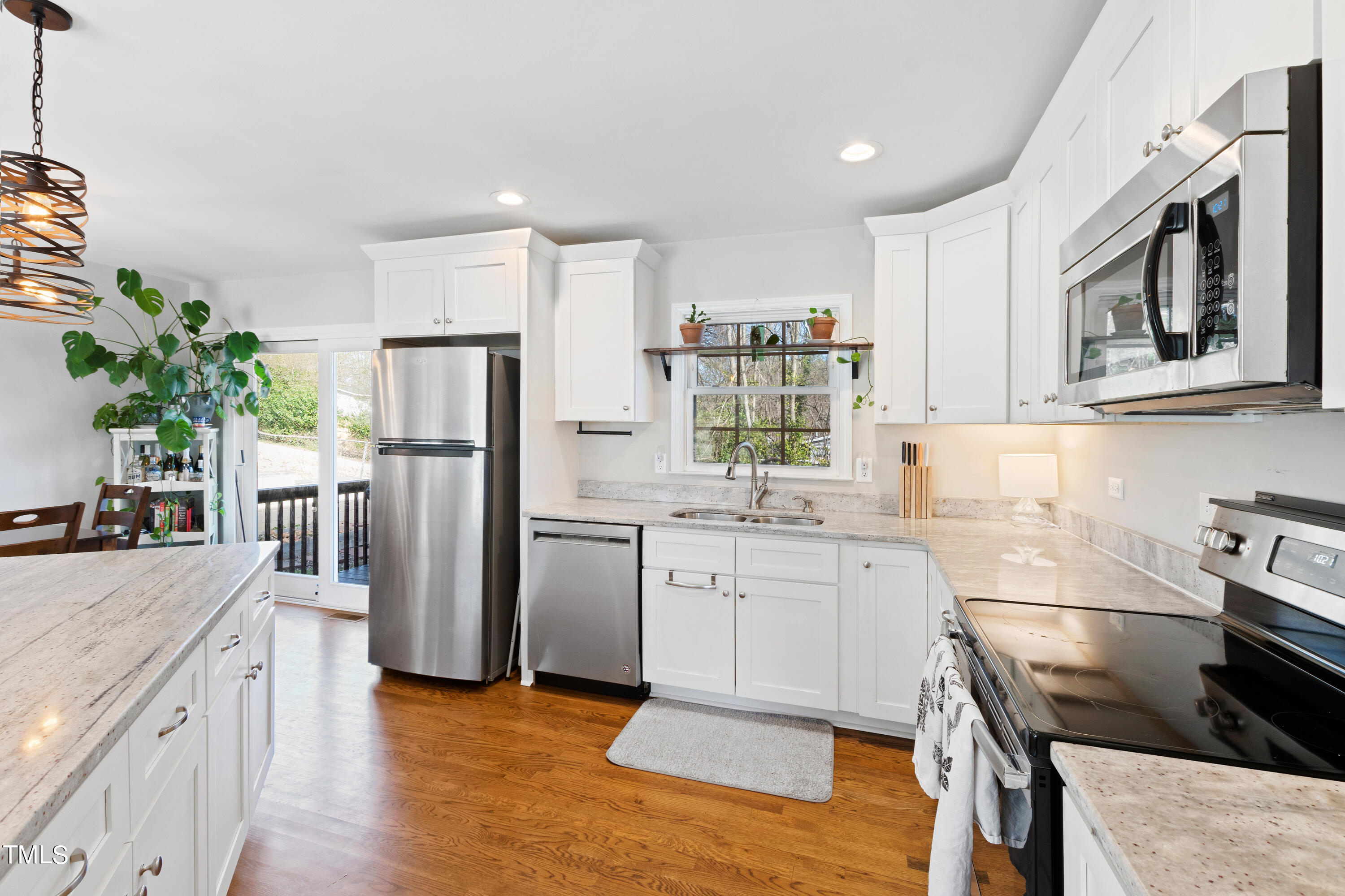 2413 Kennington Road Raleigh, NC 27610 - Photo 13 of 33 a kitchen with stainless steel appliances granite countertop a refrigerator sink and stove