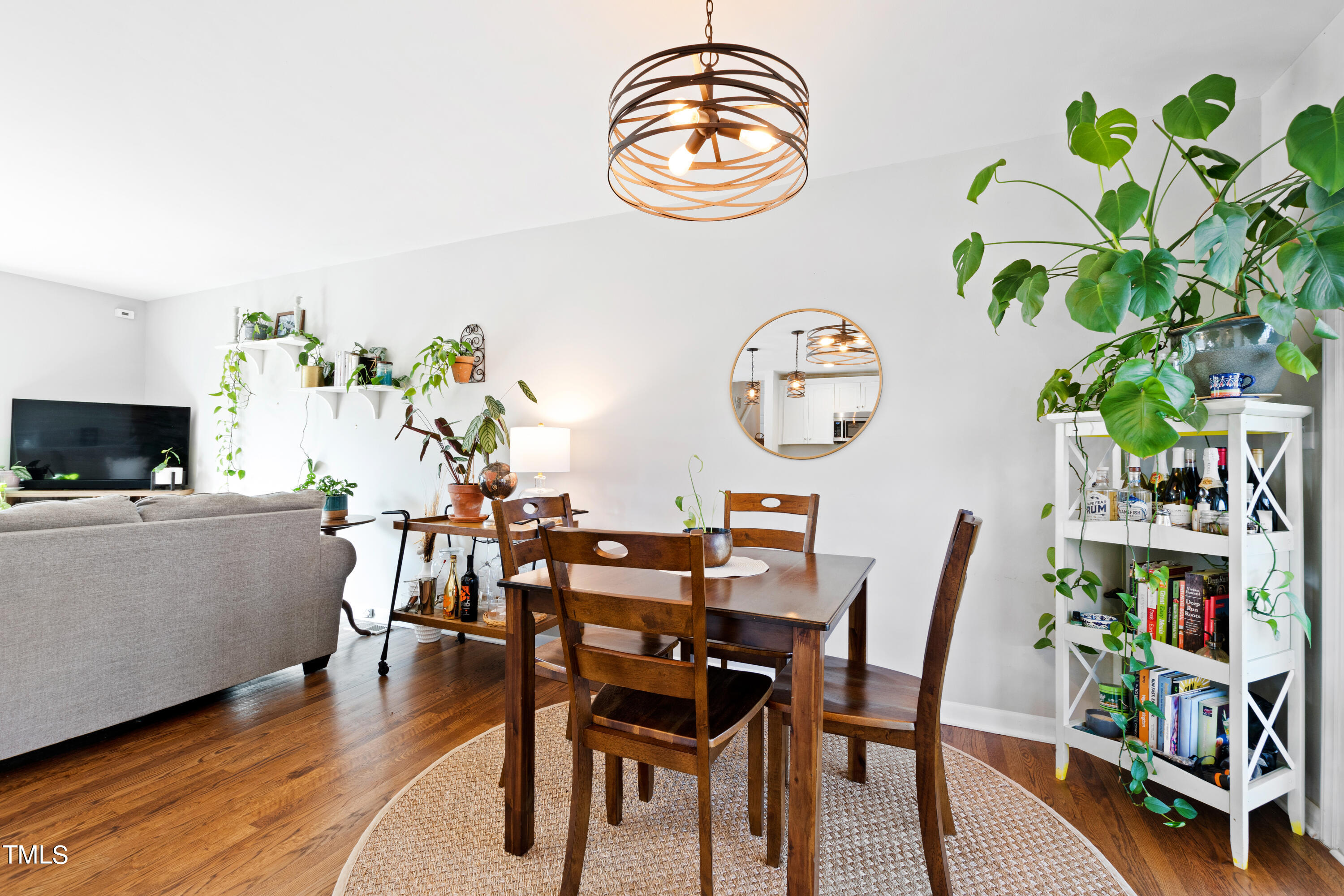 2413 Kennington Road Raleigh, NC 27610 - Photo 17 of 33 a view of a dining room with furniture and a potted plant