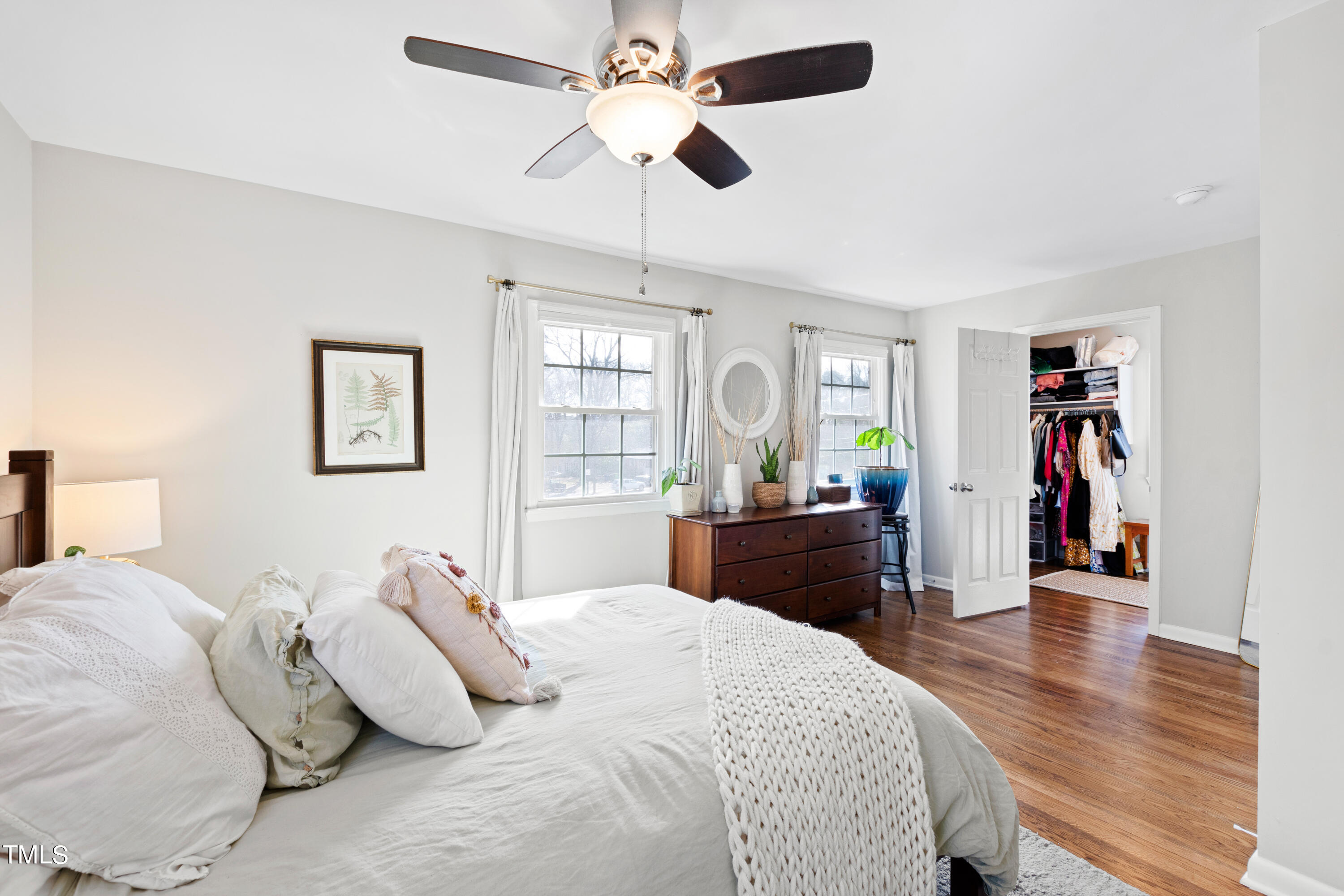 2413 Kennington Road Raleigh, NC 27610 - Photo 20 of 33 a bedroom with a bed and wooden floor
