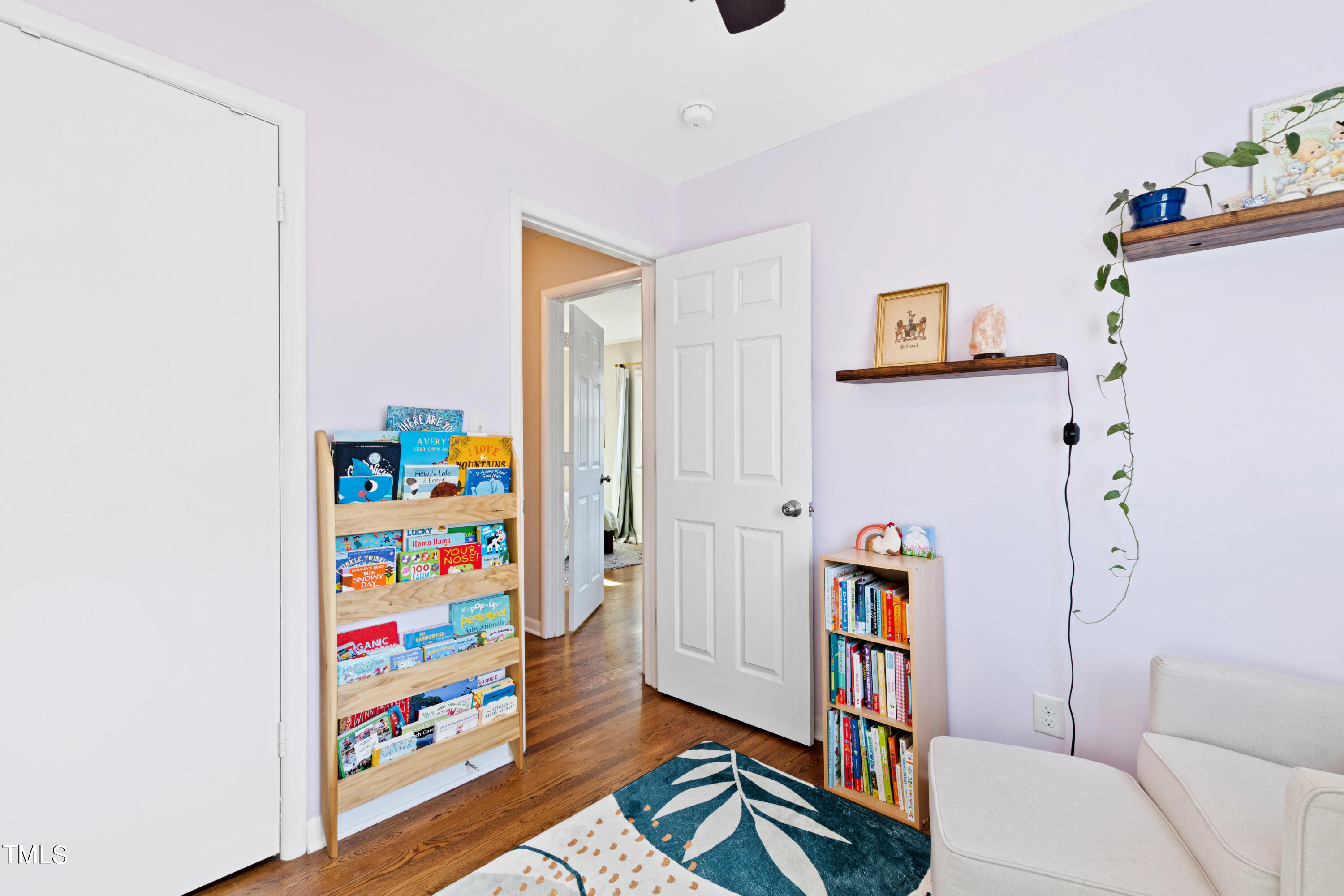 2413 Kennington Road Raleigh, NC 27610 - Photo 23 of 33 a living room with furniture and a baby crib