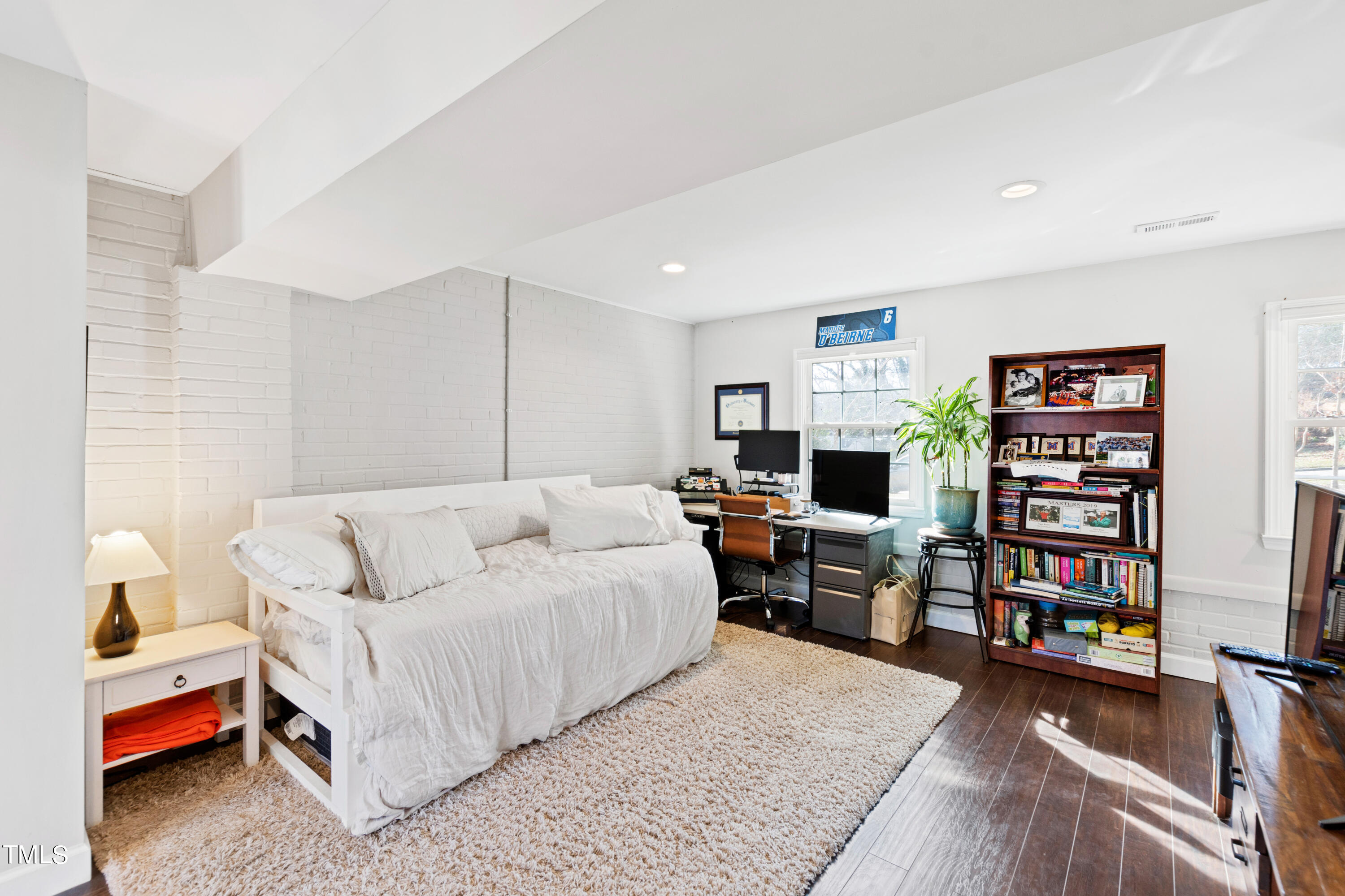 2413 Kennington Road Raleigh, NC 27610 - Photo 24 of 33 a bedroom with a bed furniture and a flat screen tv