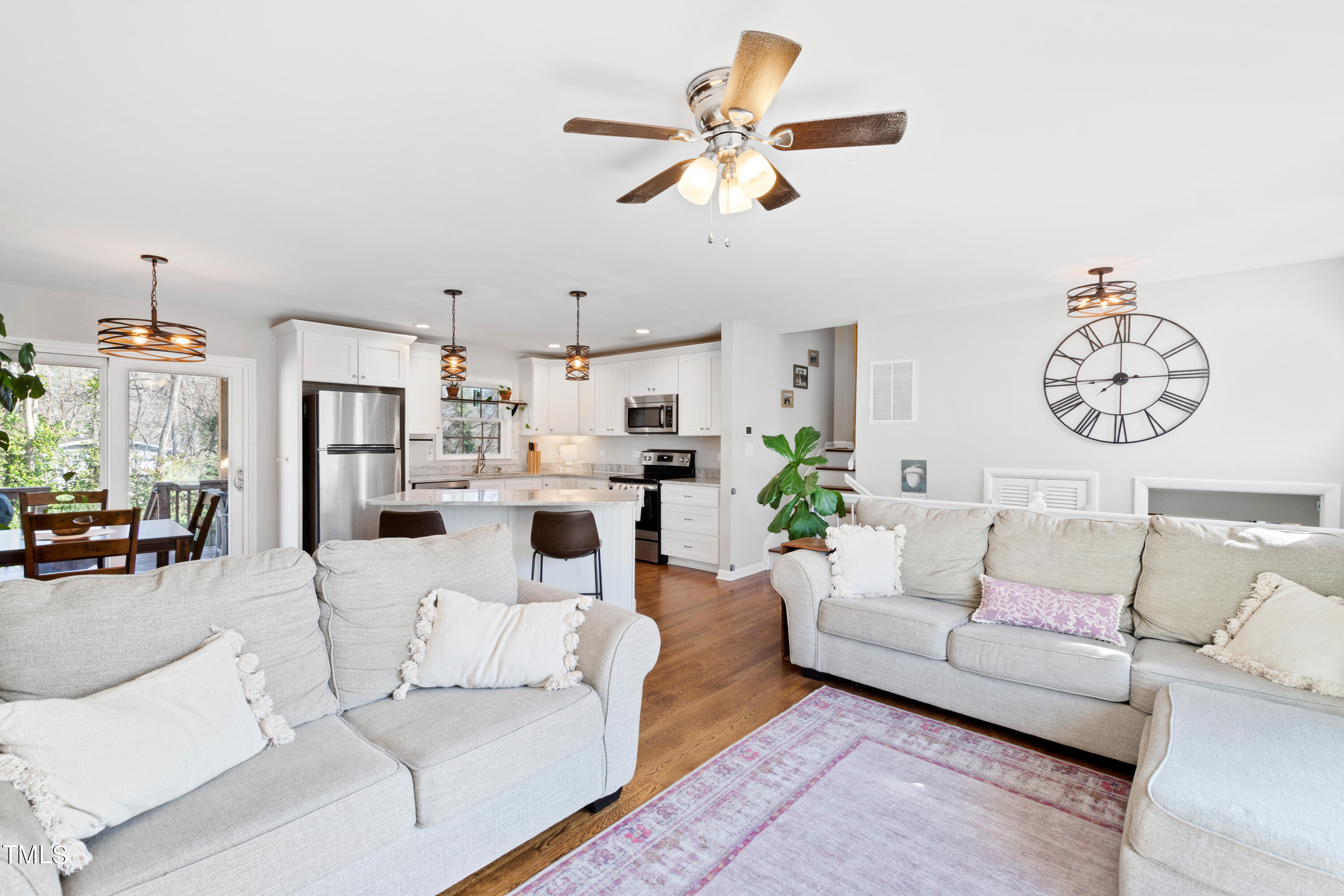 2413 Kennington Road Raleigh, NC 27610 - Photo 3 of 33 a living room with furniture kitchen view and a chandelier