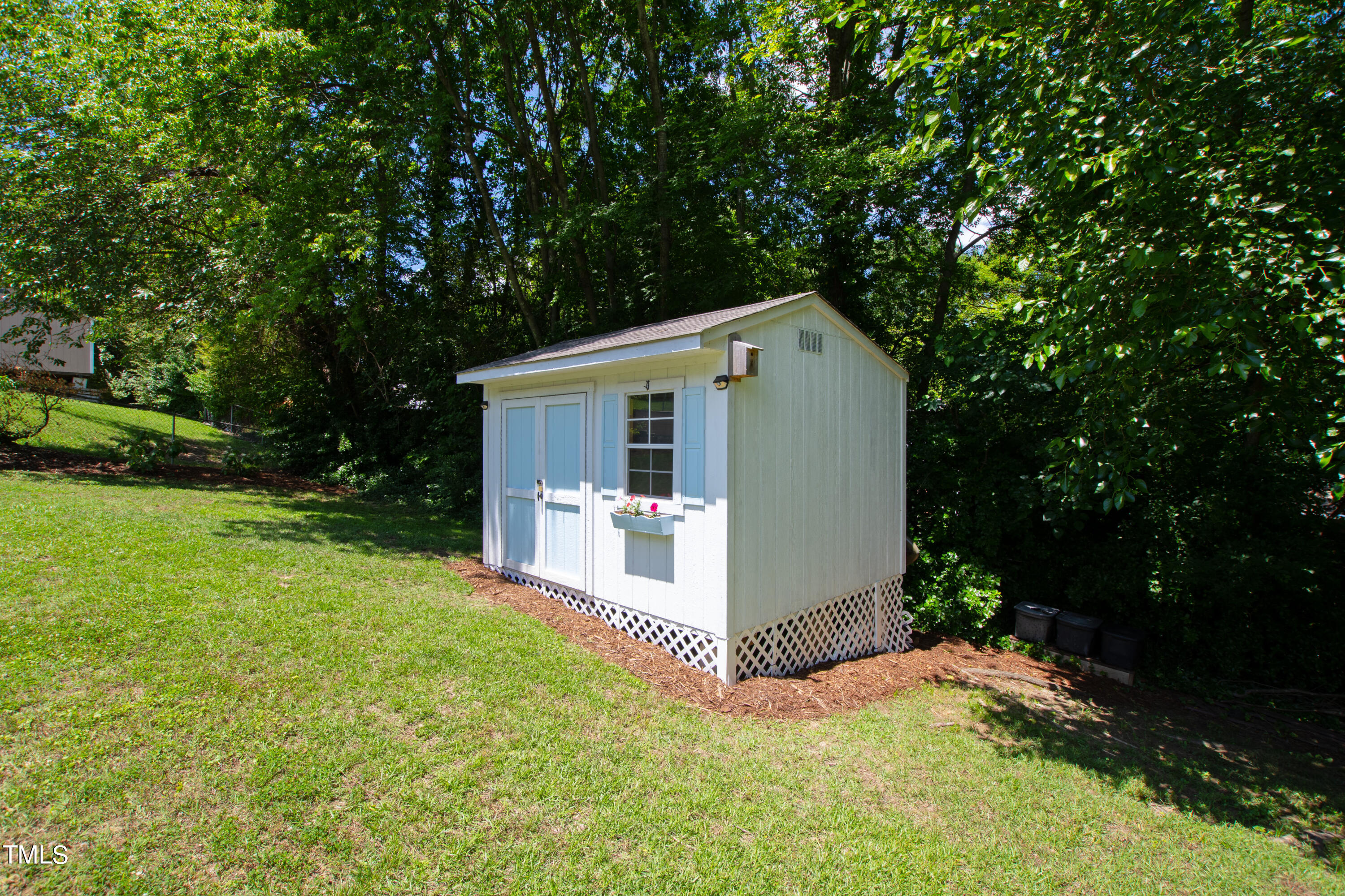 2413 Kennington Road Raleigh, NC 27610 - Photo 32 of 33 front view of a house with a yard and potted plants