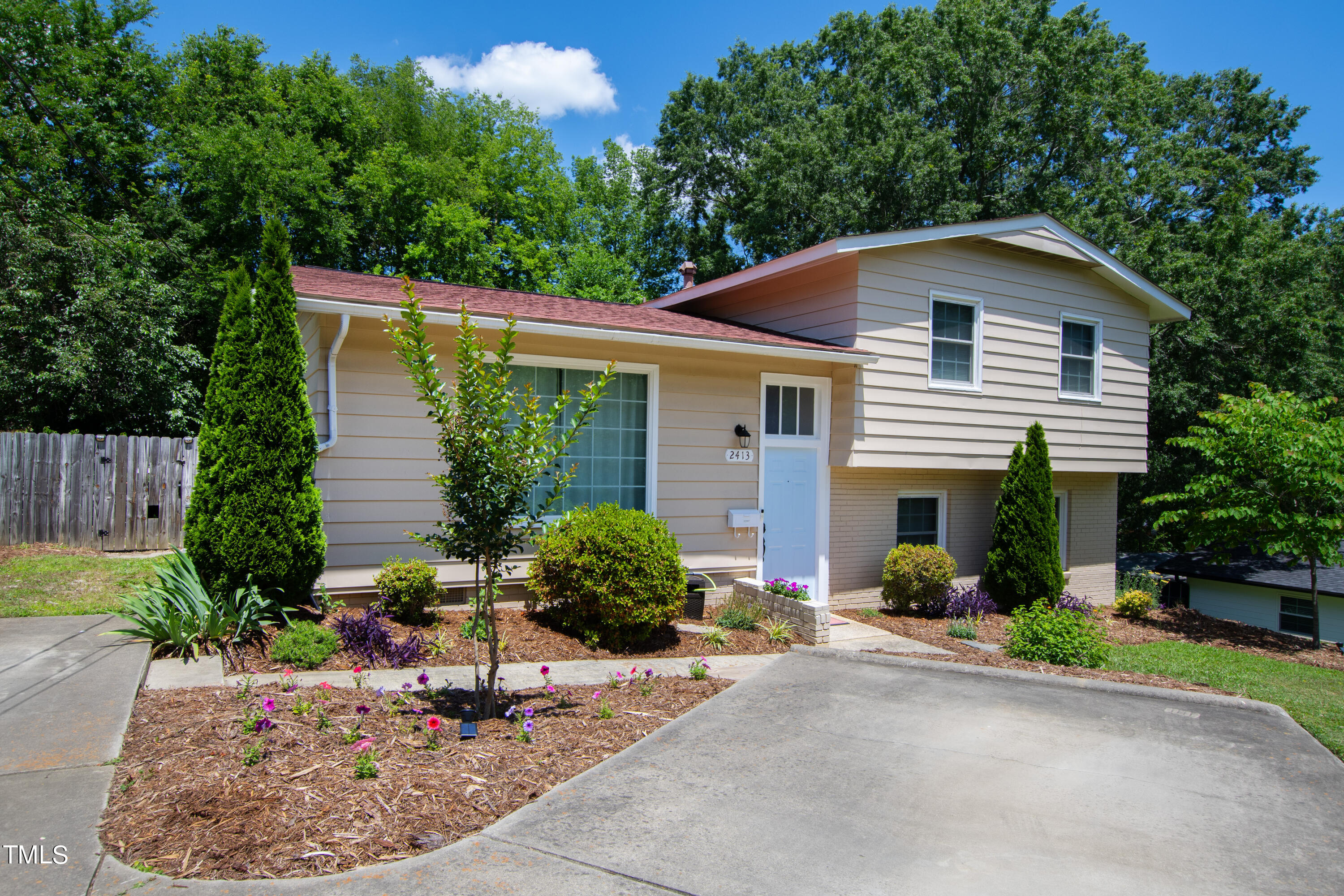 2413 Kennington Road Raleigh, NC 27610 - Photo 6 of 33 a view of a house with backyard and sitting area