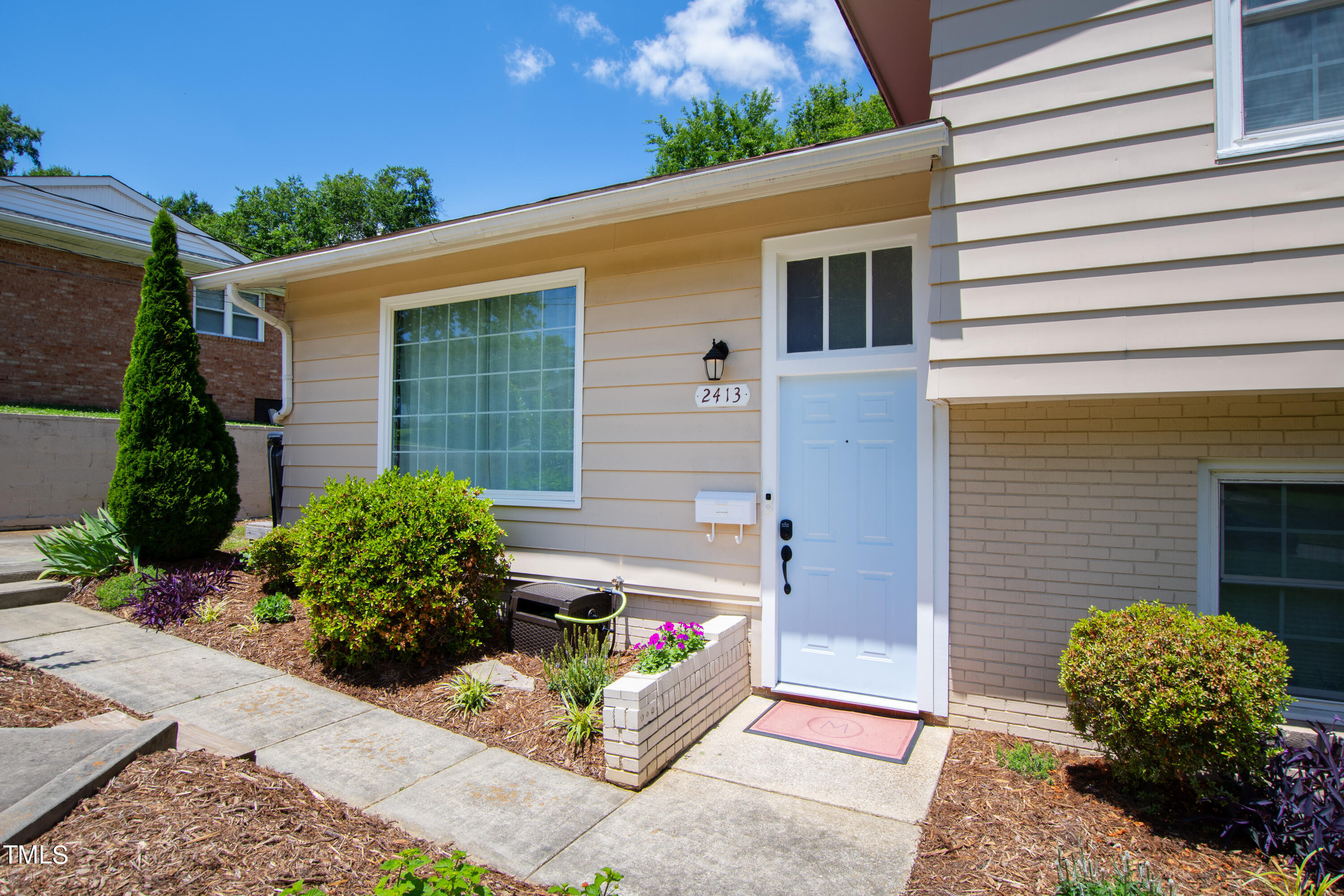 2413 Kennington Road Raleigh, NC 27610 - Photo 7 of 33 a house view with a backyard space