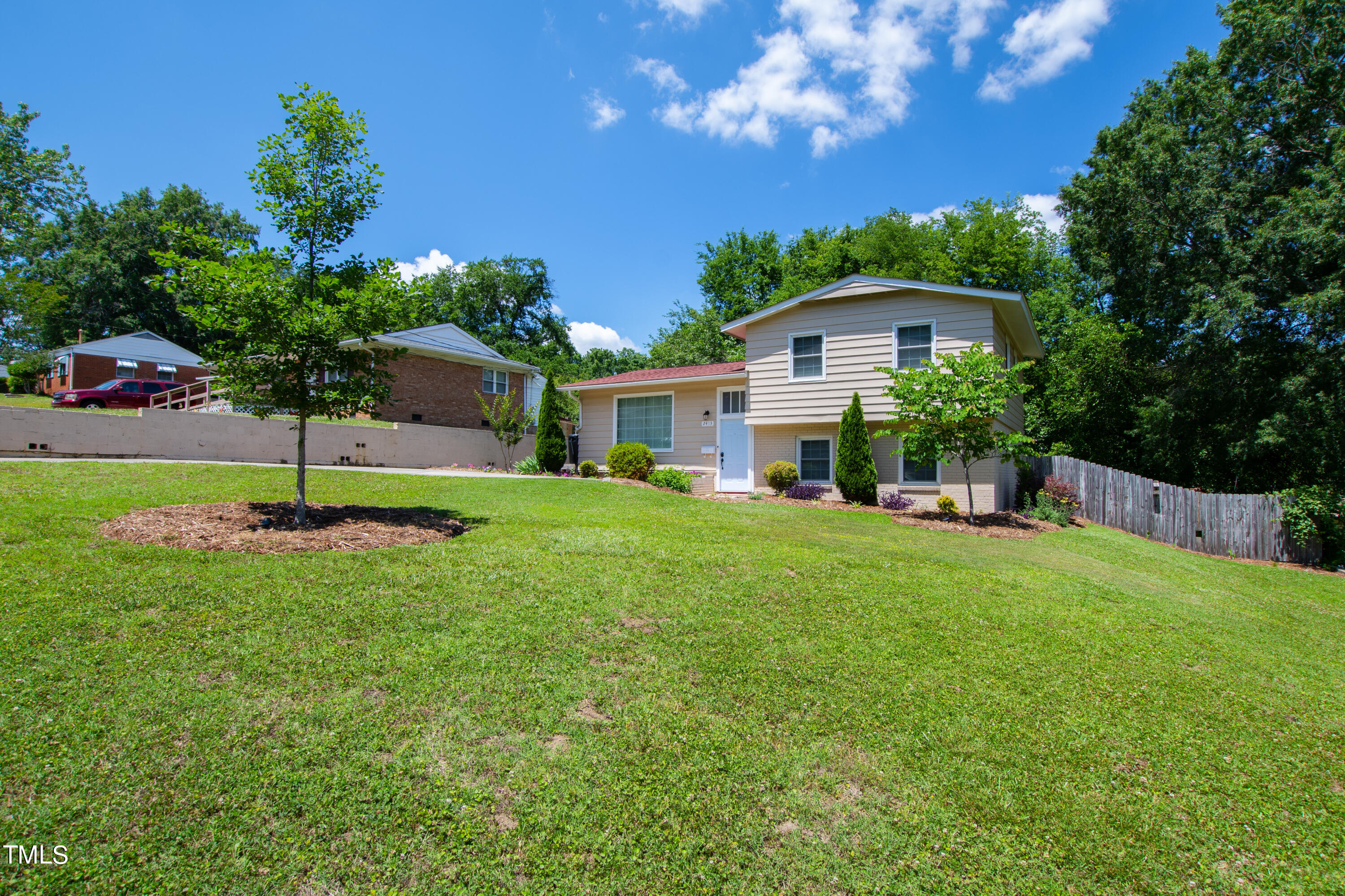 2413 Kennington Road Raleigh, NC 27610 - Photo 8 of 33 a view of an house with backyard and a tree