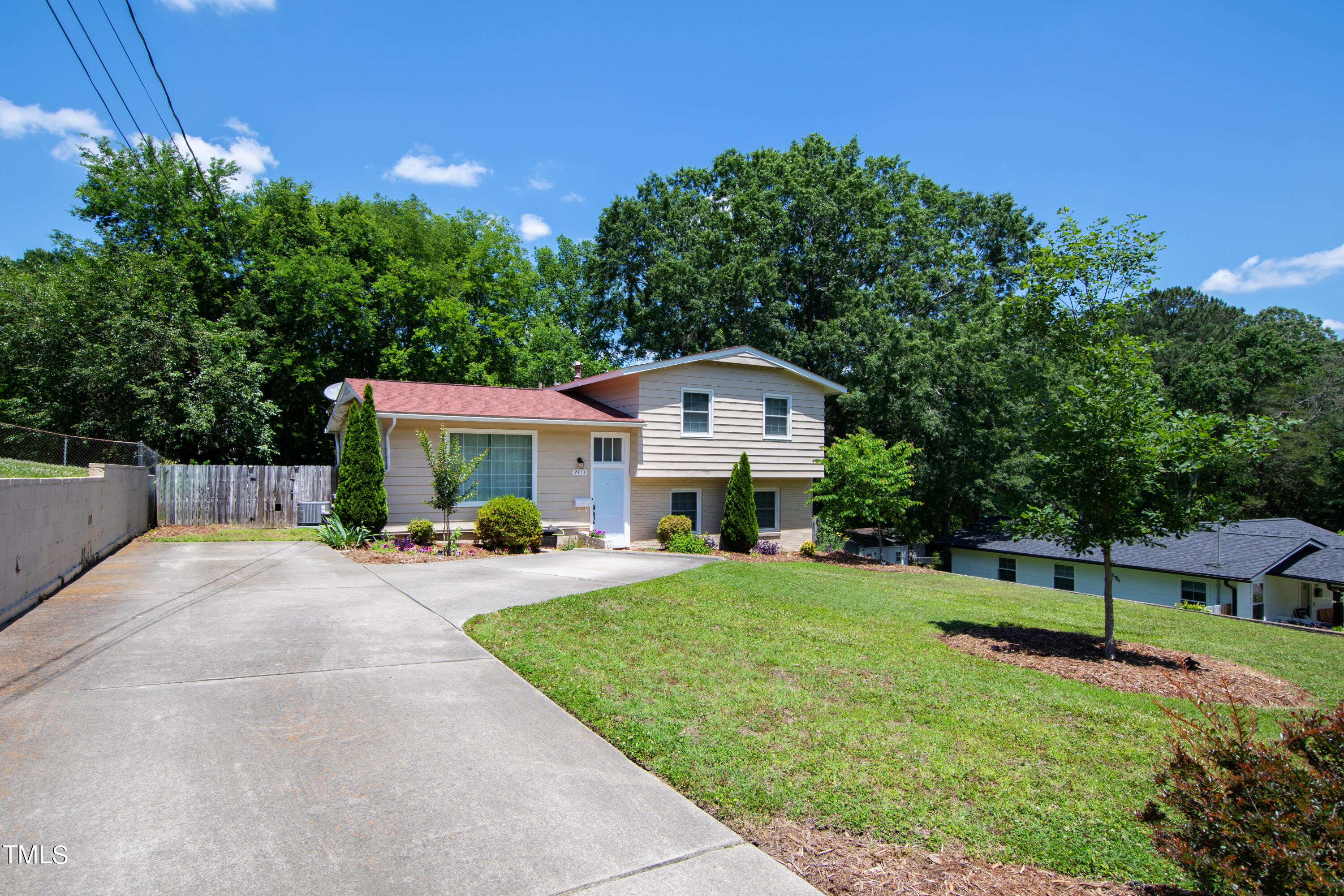 2413 Kennington Road Raleigh, NC 27610 - Photo 9 of 33 a front view of house with yard and green space