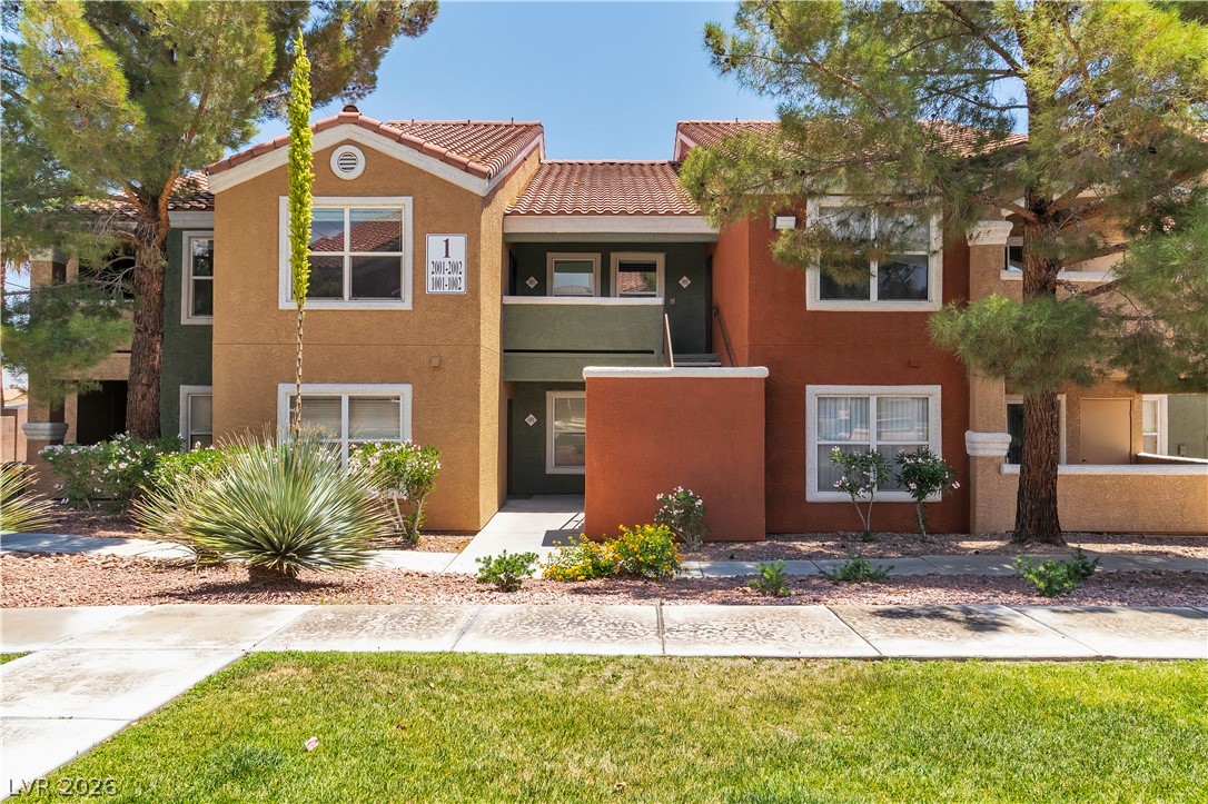 8101 West Flamingo Road, Unit 2001 Las Vegas, NV 89147 - Photo 1 of 28 Multi-colored exterior with a Spanish tile roof provides inviting curb appeal.