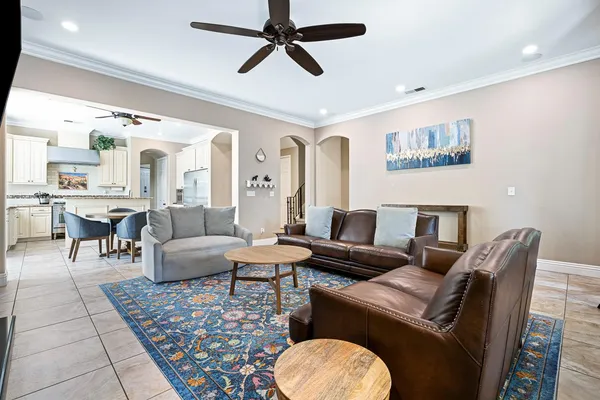 a living room with furniture and a rug