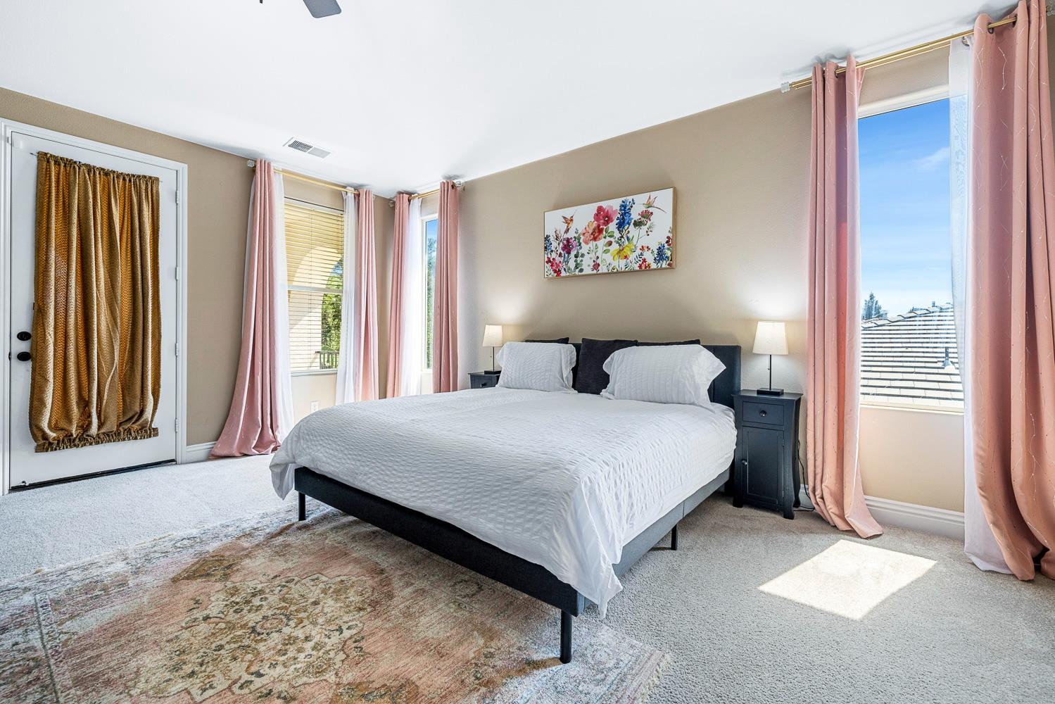 3133 Everglade Avenue Clovis, CA 93619 - Photo 22 of 33 a bedroom with a bed and a painting on the wall