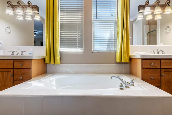 a bathroom with a bathtub and a sink