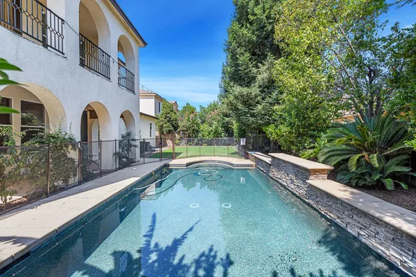 a view of a swimming pool with a garden