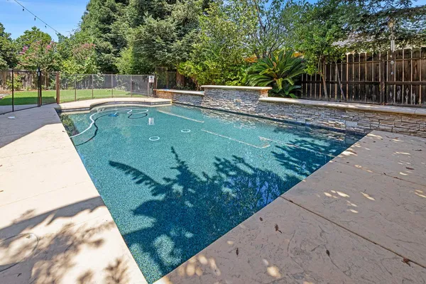 a view of a swimming pool with a patio