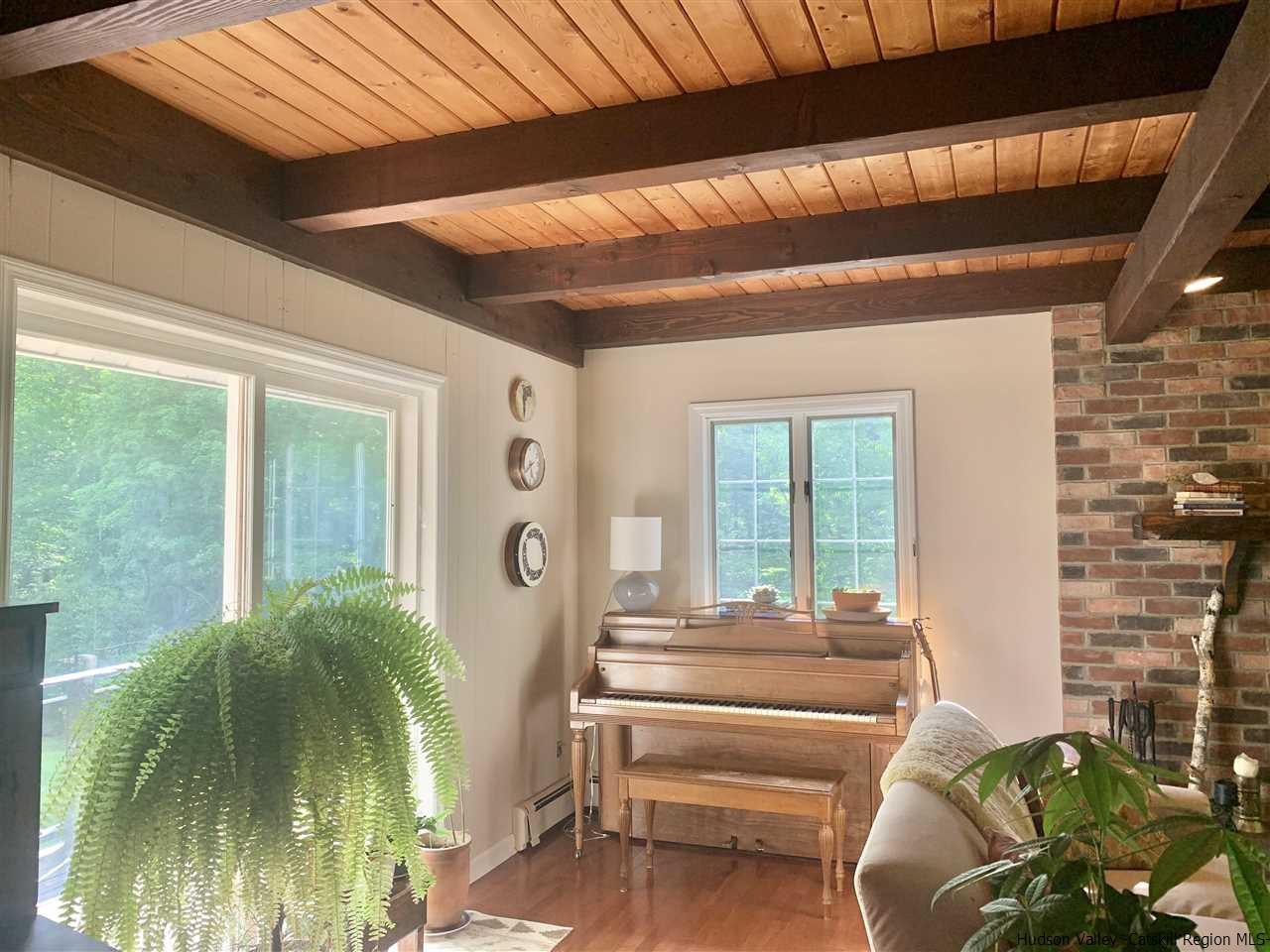 71 Brink Road Saugerties, NY 12477 - Photo 11 of 33 a view of balcony with couch and wooden floor
