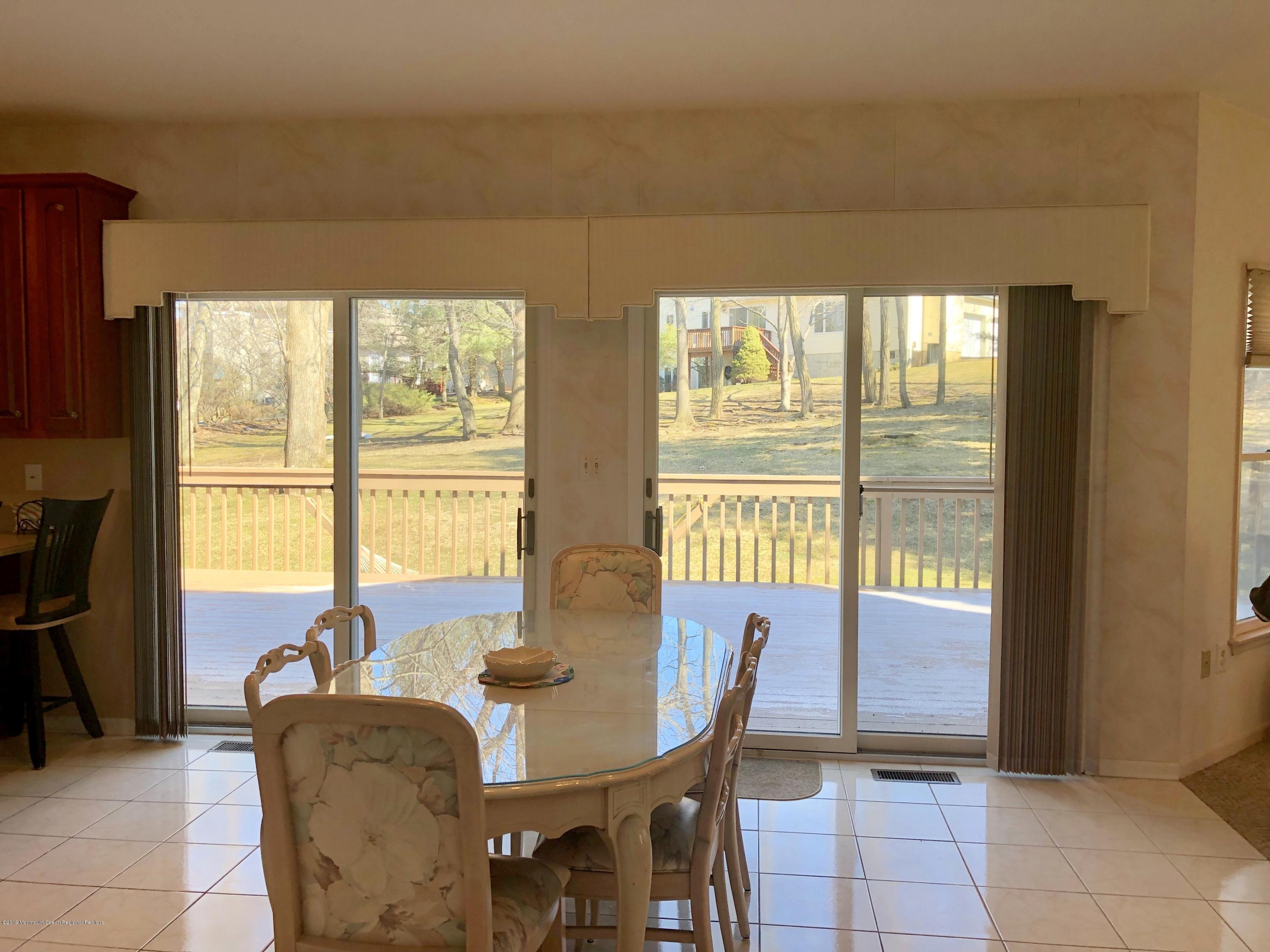 259 Nottingham Road Morganville, NJ 07751 - Photo 8 of 28 a dining room with furniture and window