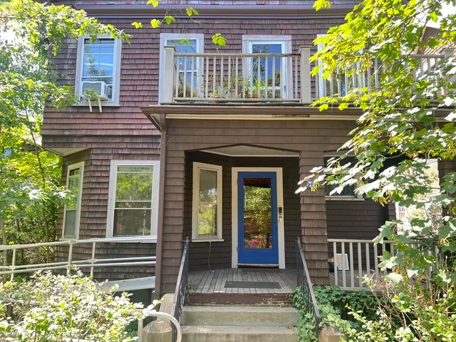 a front view of a house with a porch