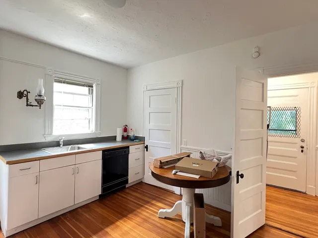 a kitchen with a sink and cabinets